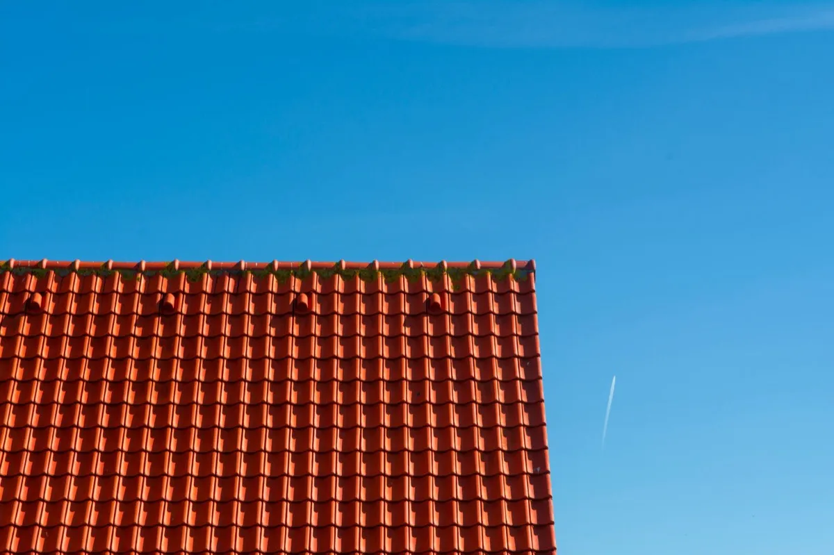 Tile roof gable in full sun, the kind of exposure that sets roof life in Victoria, TX